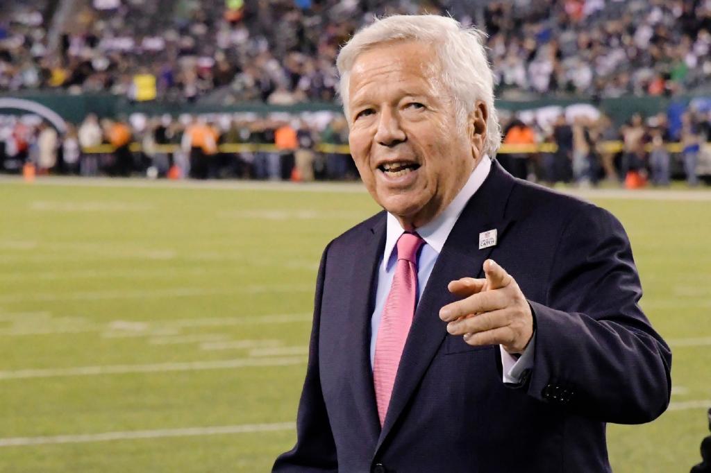 New England Patriots owner Robert Kraft points to fans as his team warms up before an NFL football game against the New York Jets in East Rutherford, N.J.