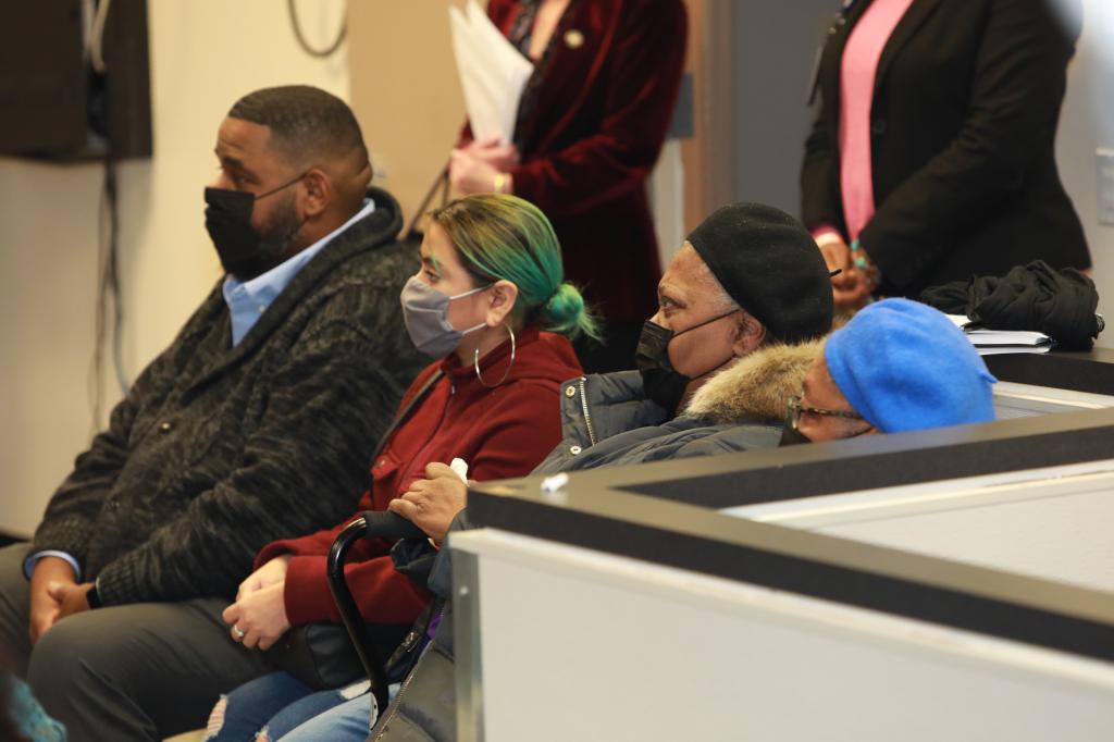 Minerliz Soriano's family listens as the Bronx DA addresses the media and them in regard to the 1999 cold case.