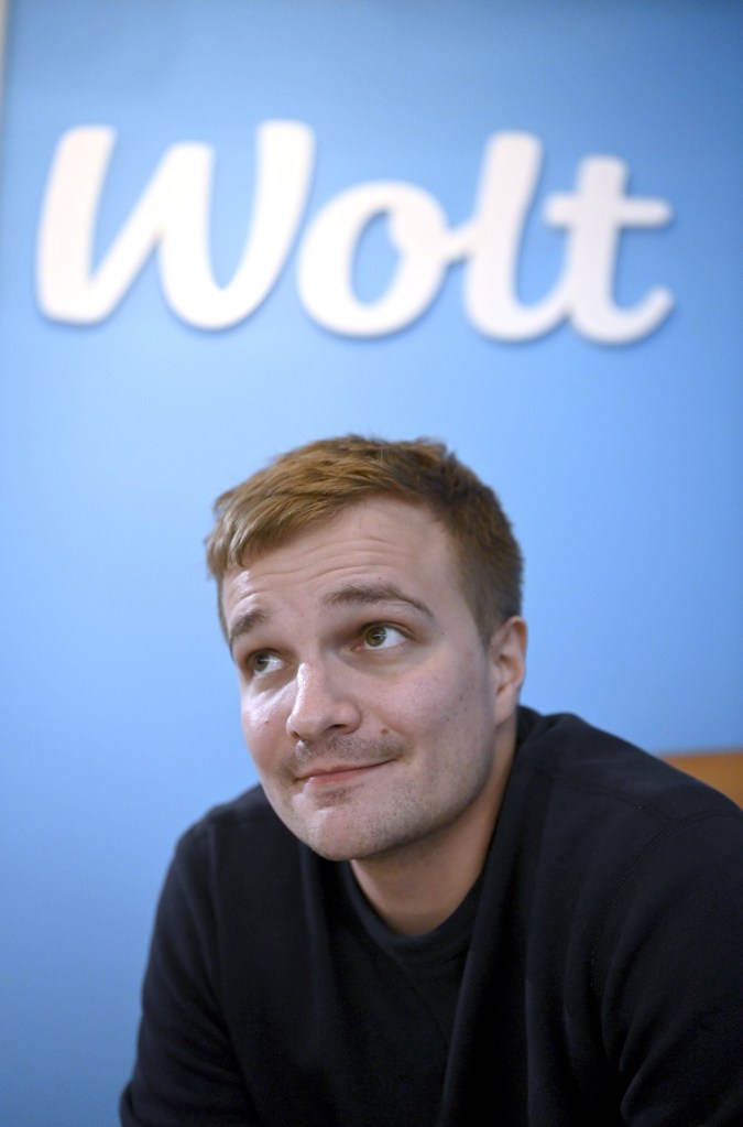 Headshot of Wolt CEO, Miki Kuusi, below the company's logo.