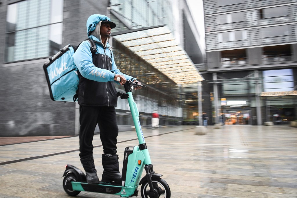 A Wolt worker on a scooter.