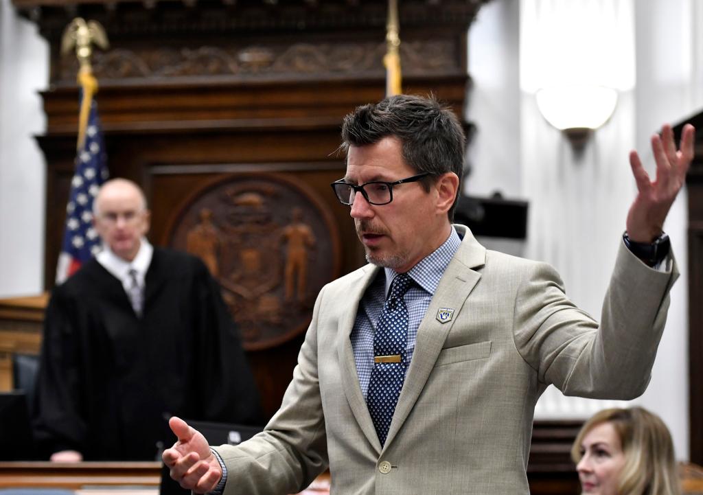 Assistant District Attorney Thomas Binger (right) reacts to arguments on a video during proceedings in the Kyle Rittenhouse trial at the Kenosha County Courthouse on November 12, 2021.