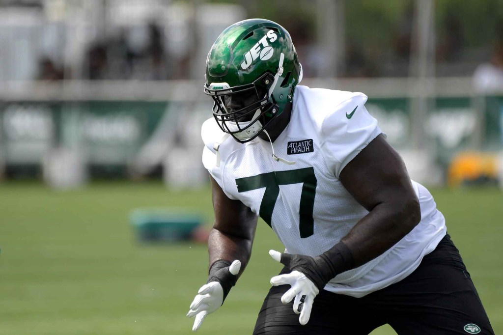 Jets offensive tackle Mekhi Becton (77) during practice