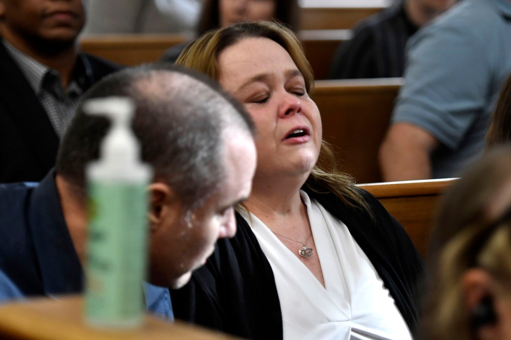 Kyle Rittenhouse's mother, Wendy Rittenhouse, reacts as her son is found not guilty on all counts.