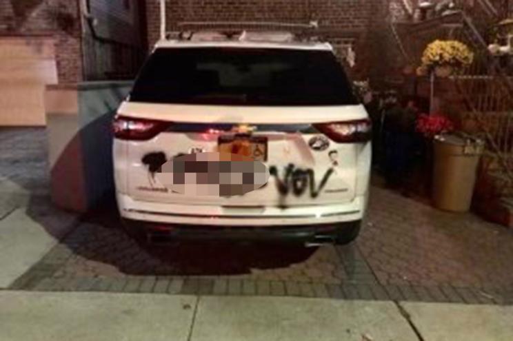 Vandals spay painted a police vehicle in Middle Village on Nov. 19, 2021.