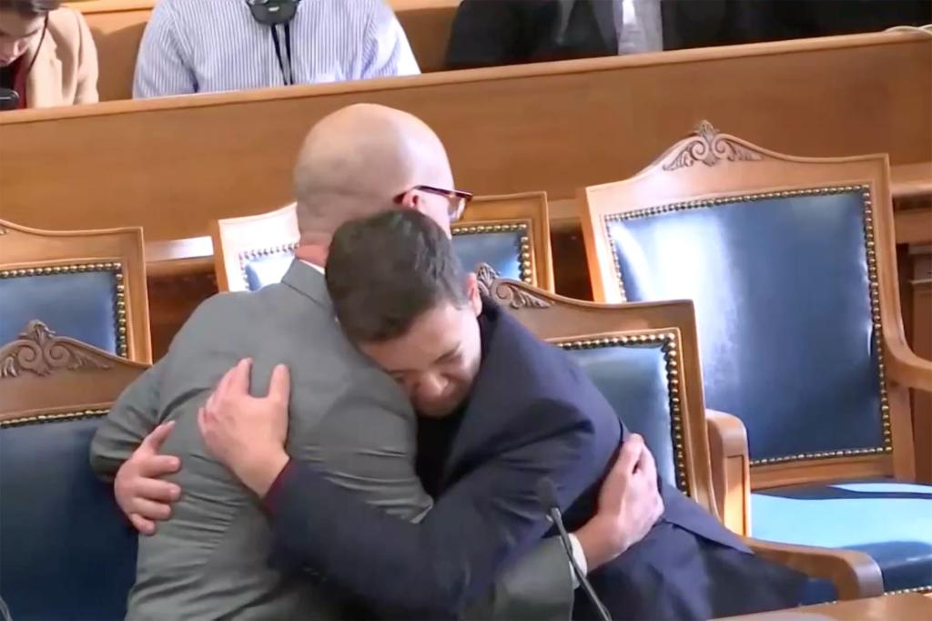 Kyle Rittenhouse embraces his lawyer after the verdict was read.