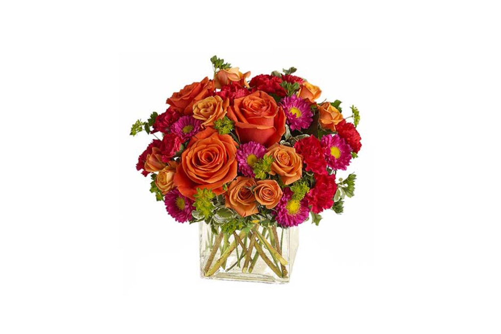 A vase of orange flowers