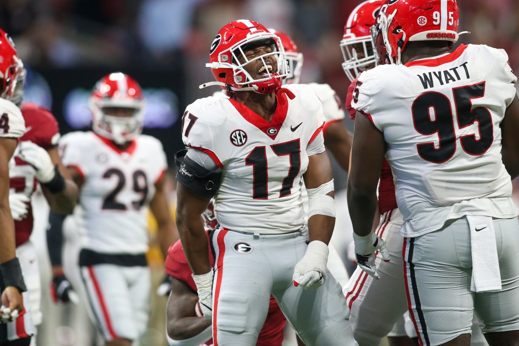 Georgia Bulldogs linebacker Nakobe Dean (17) celebrates after a tackle against Alabama in the first half of the SEC championship game at Mercedes-Benz Stadium.