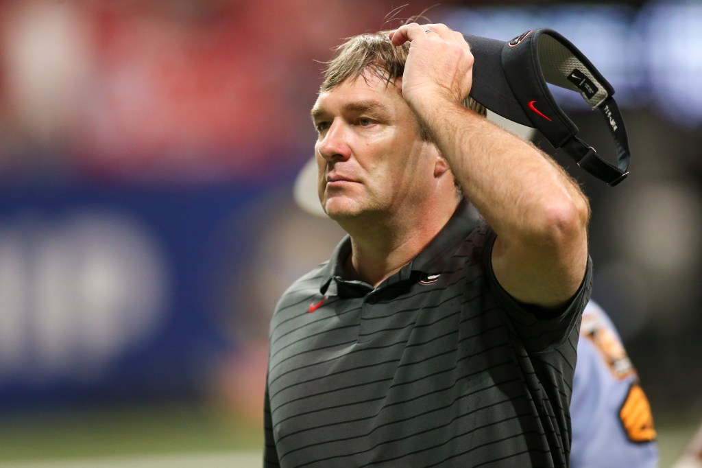 Georgia head coach Kirby Smart walks off the field after a loss to Alabama in the SEC championship game at Mercedes-Benz Stadium.