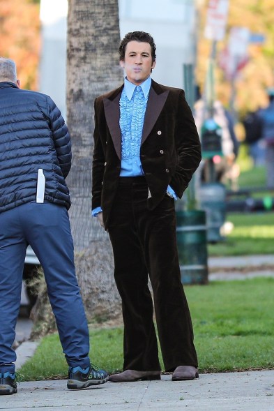 No, that’s not a pic of his papa, Miles Teller is just looking dapper on the set of “The Godfather” spinoff “The Offer.”