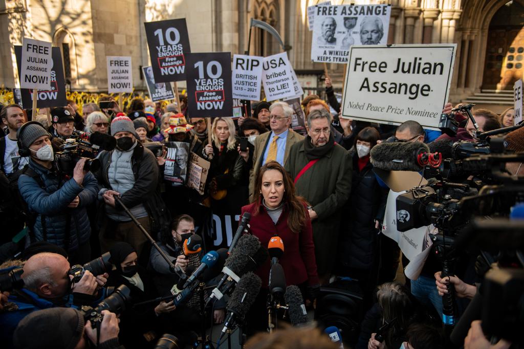 Stella Morris, Julian Assange's partner, speaks to the press outside the Royal Courts of Justice following the extradition hearing.