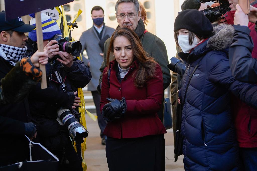 Stella Morris, Julian Assange's partner, leaves after speaking to reporters outside the Royal Courts of Justice.