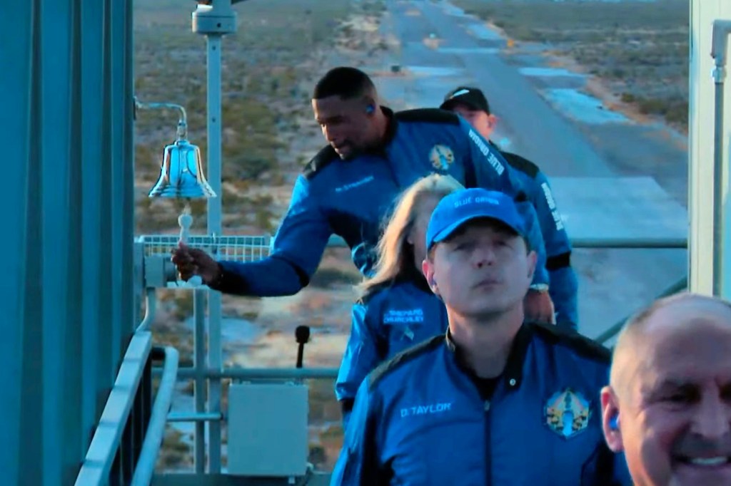 Video grab shows Strahan ringing the bell as he gets ready to board the space craft.