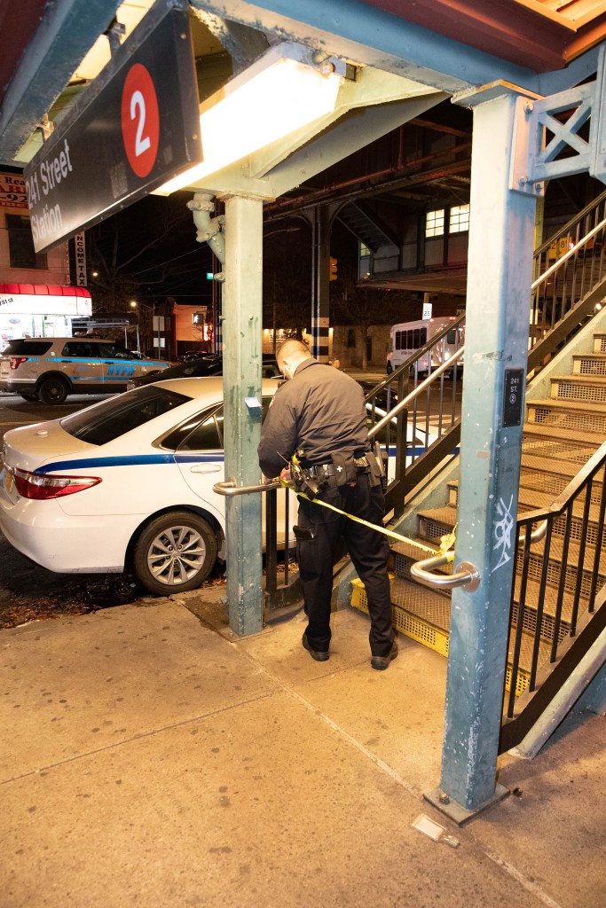 Police tape off subway entrance.