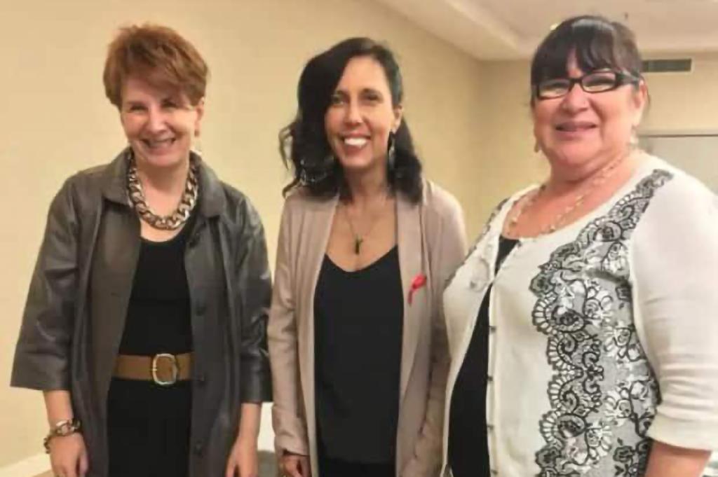 Co-workers Caroline Tait (left) and Winona Wheeler (right) began looking into Bourassa's (center) heritage in 2019.