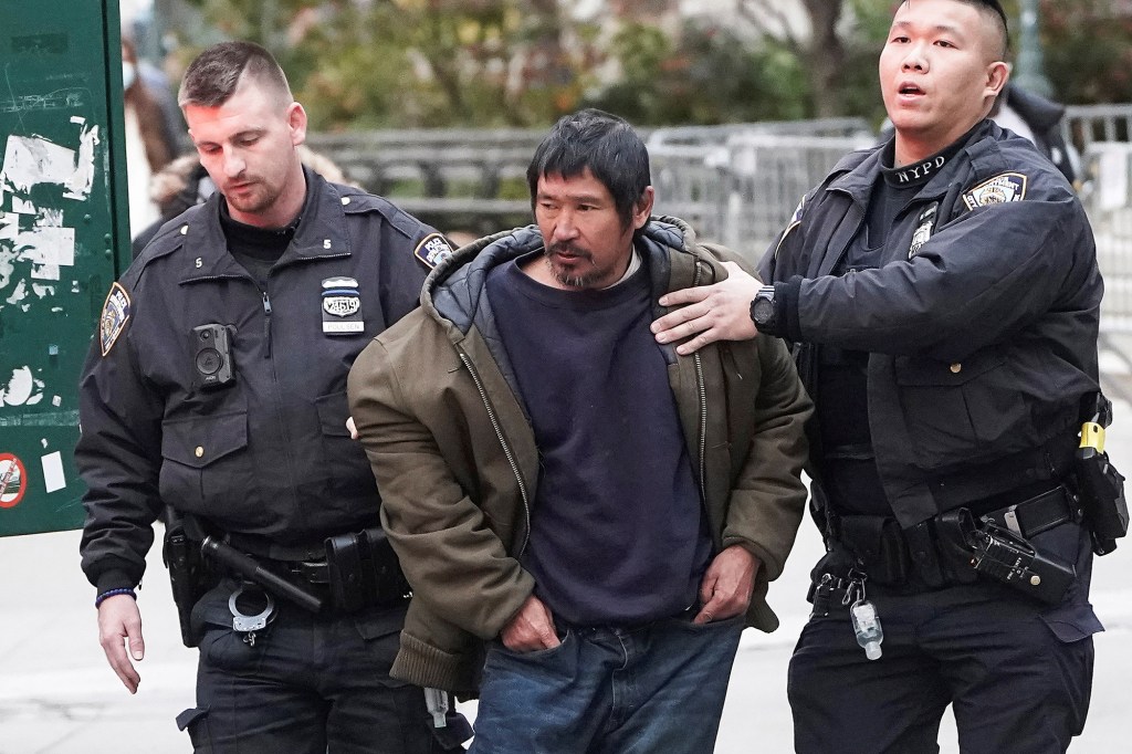 Craig Tamanaha is detained by police in Nov. 2021.