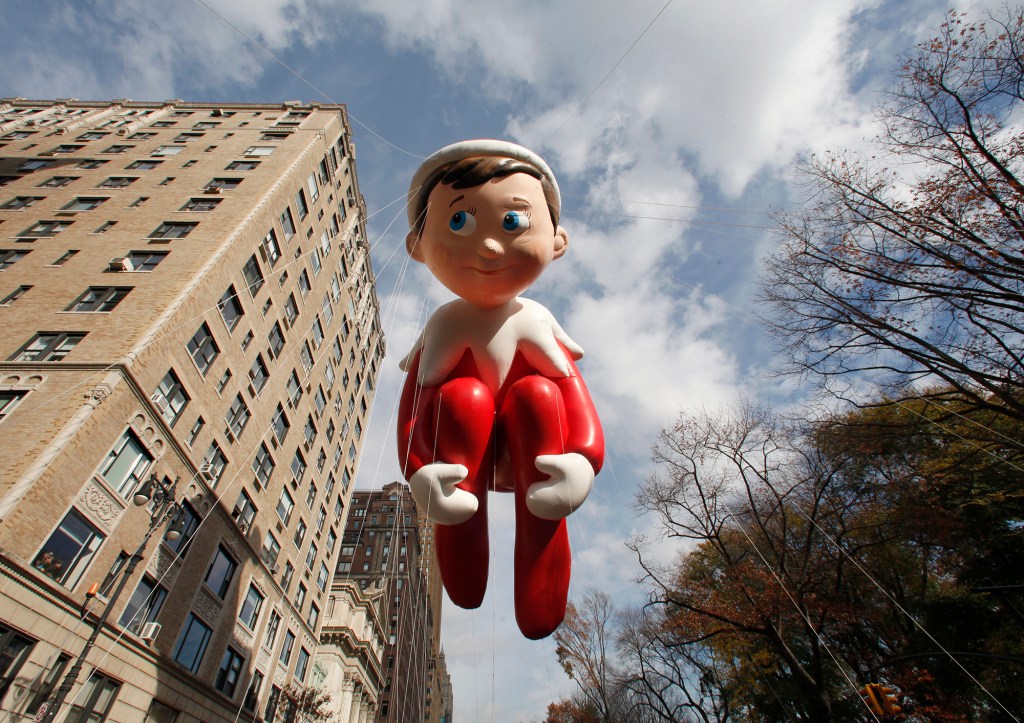 The Elf on the Shelf balloon floats down Central Park West in the Macy's Thanksgiving Day Parade in New York, November 26, 2015