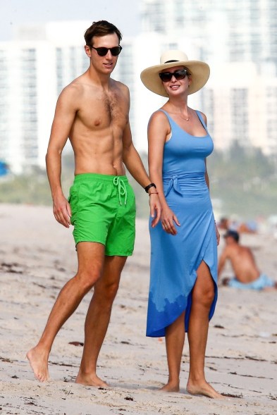 Jared Kushner and Ivanka Trump keep their hands close while spending family time at the beach in their new home base of South Florida.