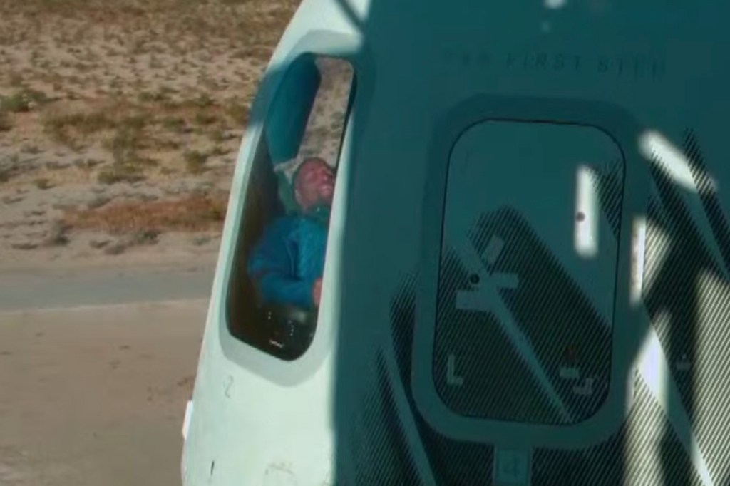 Michael Strahan sits in the Blue Origin rocket.