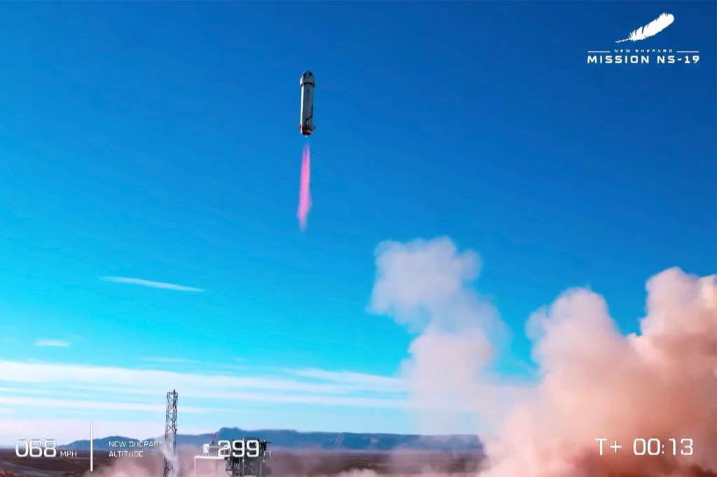 The rocket in the New Shepard Mission blasts off.