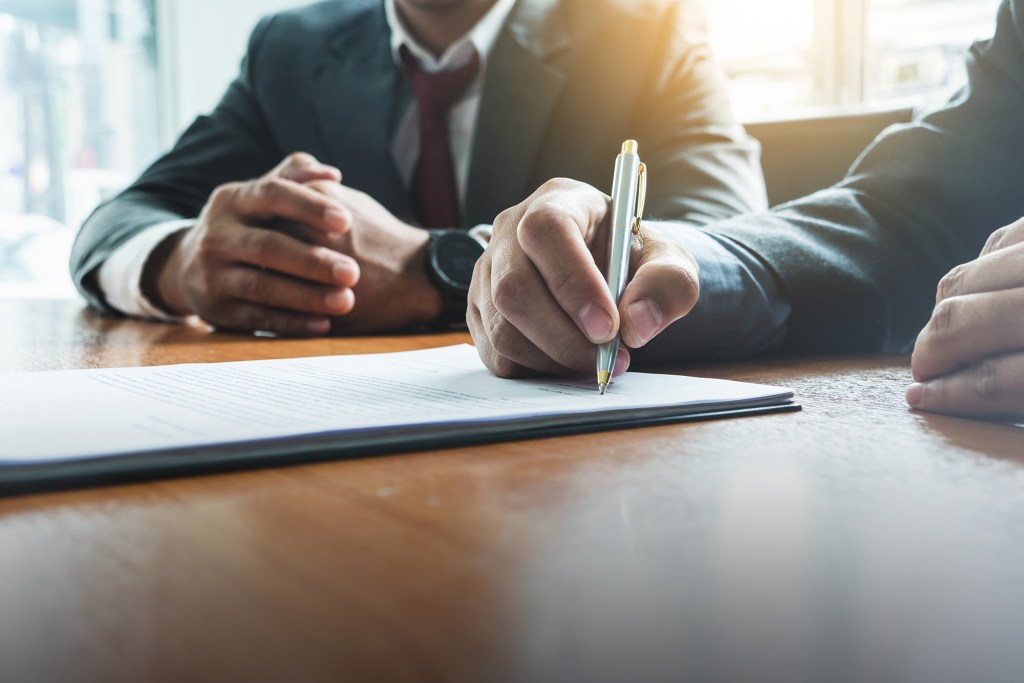 Business man sign a contract investment professional document agreement. meeting room.