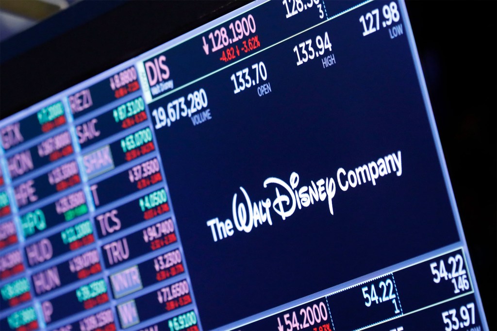 The logo for The Walt Disney Company appears above a trading post on the floor of the New York Stock Exchange.