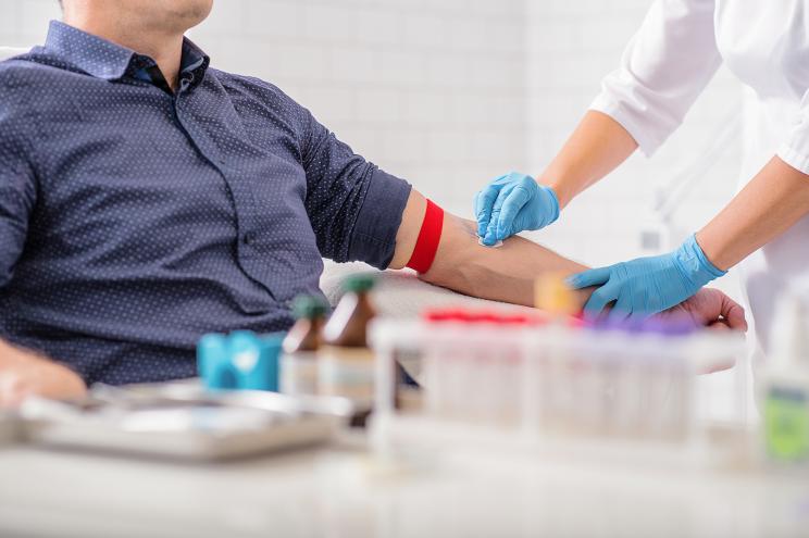 Man donates his blood.