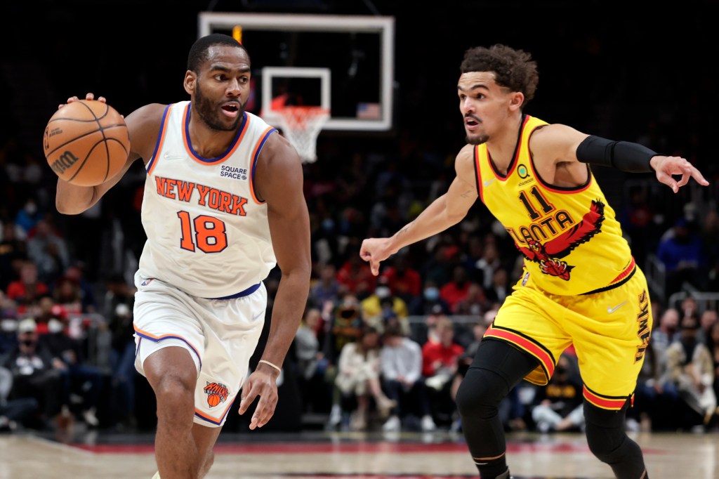 Alec Burks drives past Trae Young during the Knicks' 117-108 won over the Hawks. 