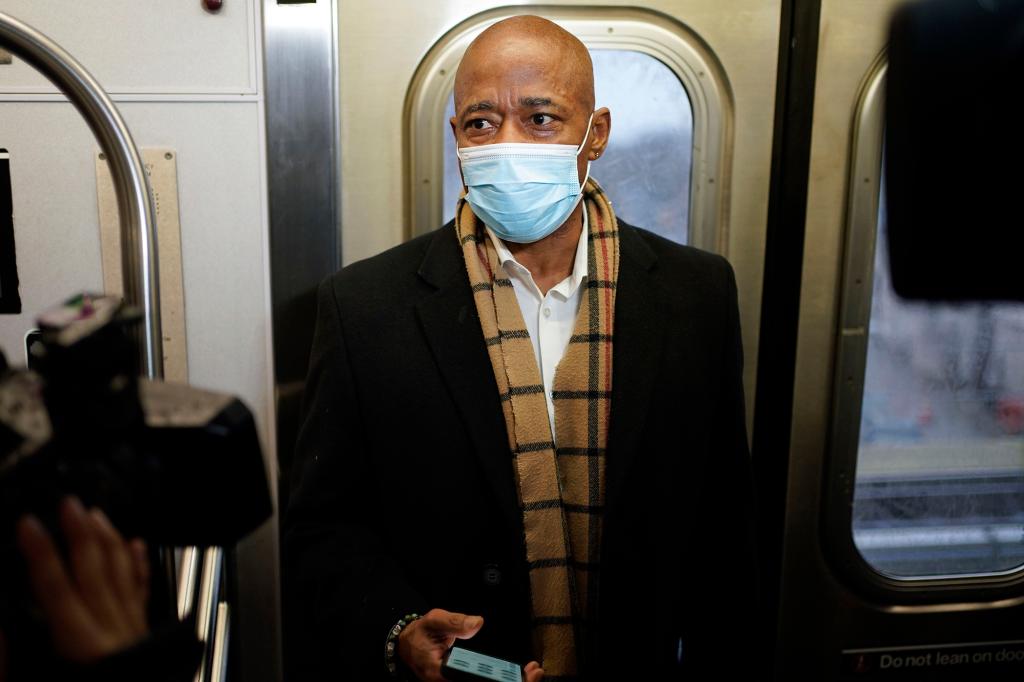 New York Mayor Eric Adams rides the subway to City Hall on his first day in office in New York.