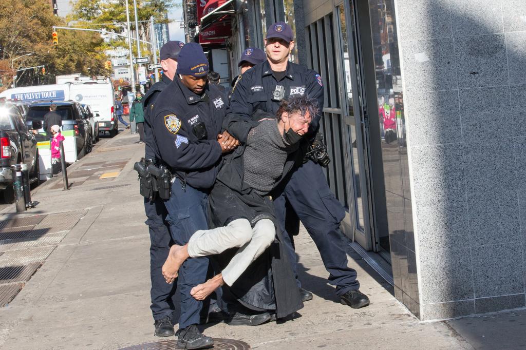 NYPD officers arrest a suspect who allegedly robbed a Rite Aid pharmacy on 8th Avenue 22 St.- 23 St. in Manhattan on Nov. 16, 2021.