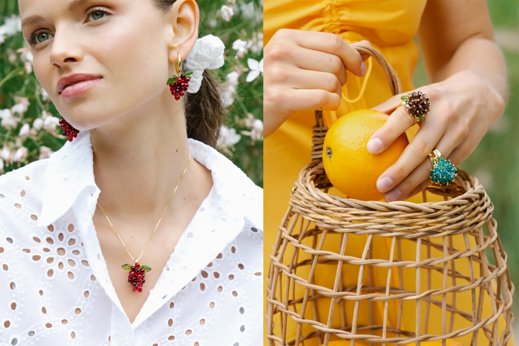 A woman in a white shirt with berry jewelry and a woman's hand holding a basket and an orange with berry rings 