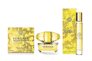 four bottles of yellow Versace perfumes