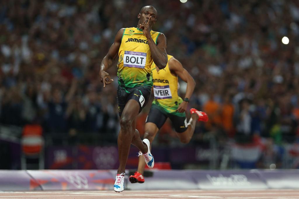 Usain Bolt of Jamaica celebrates as he crosses the finish line to claim victory and win gold during the Men's 200m Final on Day 13 of the London 2012 Olympic Games at Olympic Stadium on August 9, 2012 in London, England