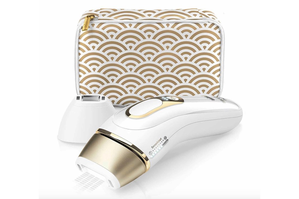 A gold and white IPL hair removal kit and case 