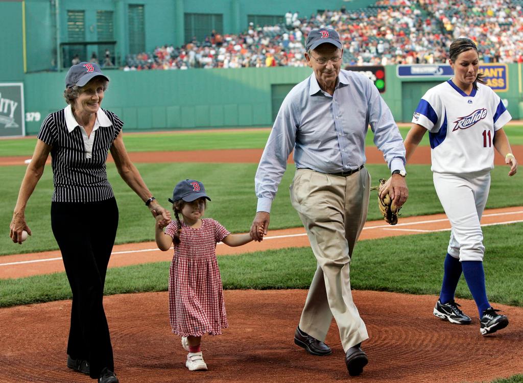 Breyer walks off the field at Fenway Park with his granddaughter, Clara.