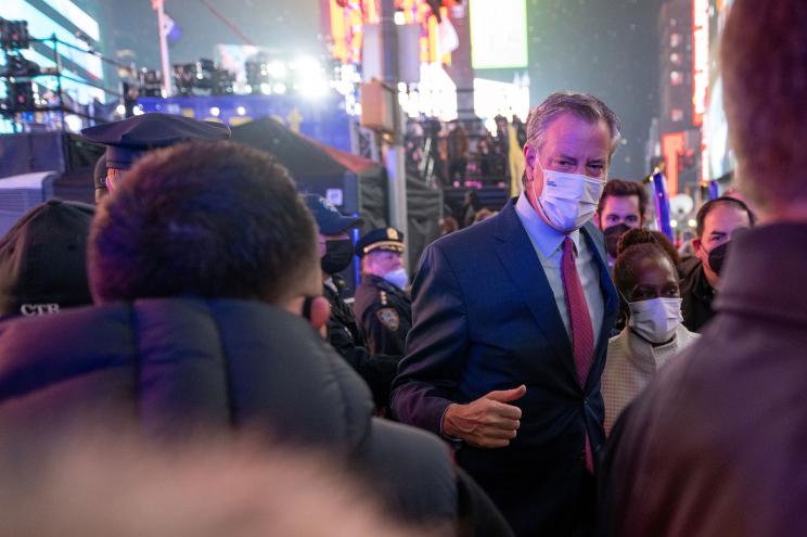 Former Mayor Bill de Blasio and his was Chirlane McCray navigate the crowd last night in Times Square.