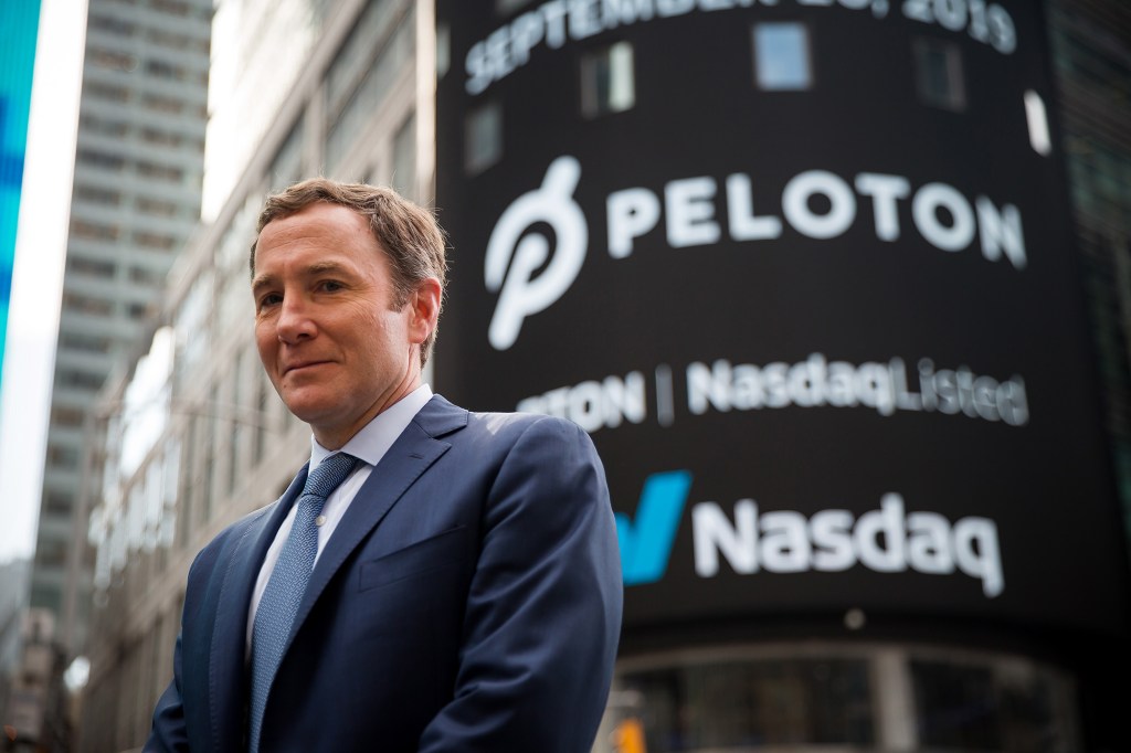 Peloton's John Foley standing outside of Nasdaq.