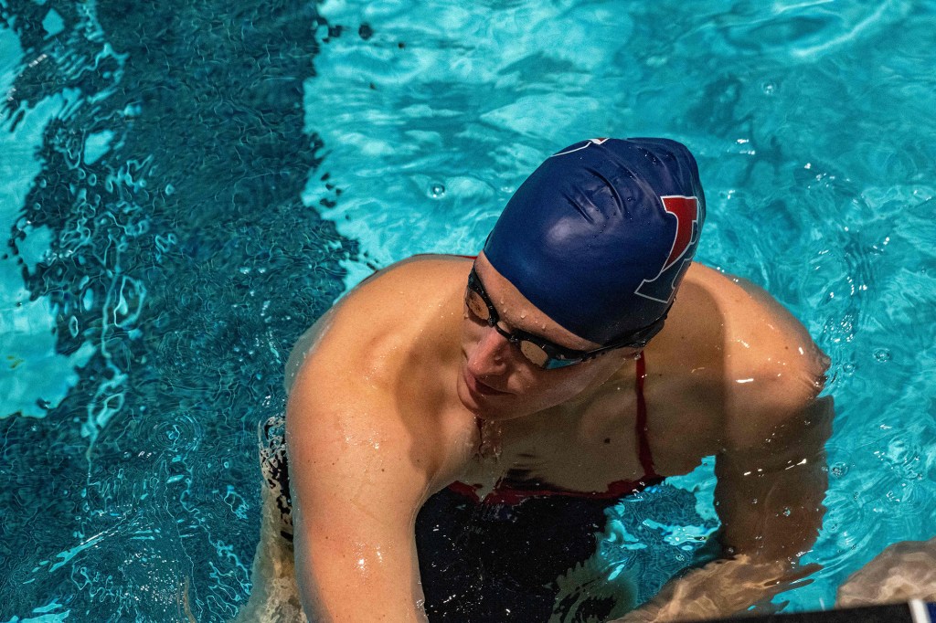 Lia Thomas, a transgender woman, holds onto the starting board as she swims for the University of Pennsylvania at an Ivy League swim meet against Harvard University in Cambridge, Massachusetts, on January 22, 2022. 