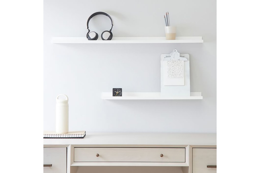 Two white shelves on a white wall 