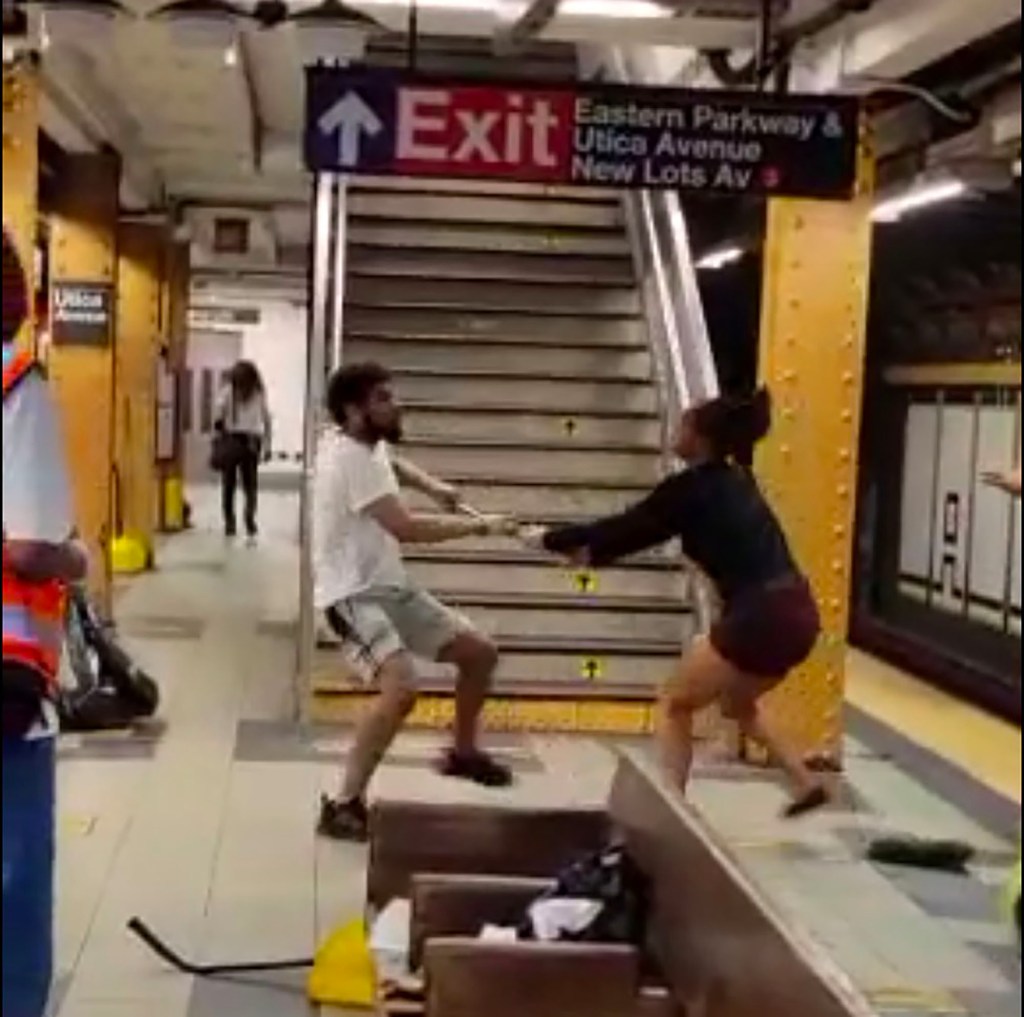 Video grabs shows a woman pushed onto subway tracks.