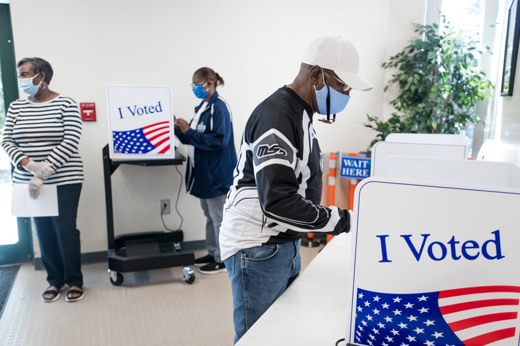 People their cast ballots at the Richland County Voter Registration & Elections Office on the second day of in-person absentee and early voting.