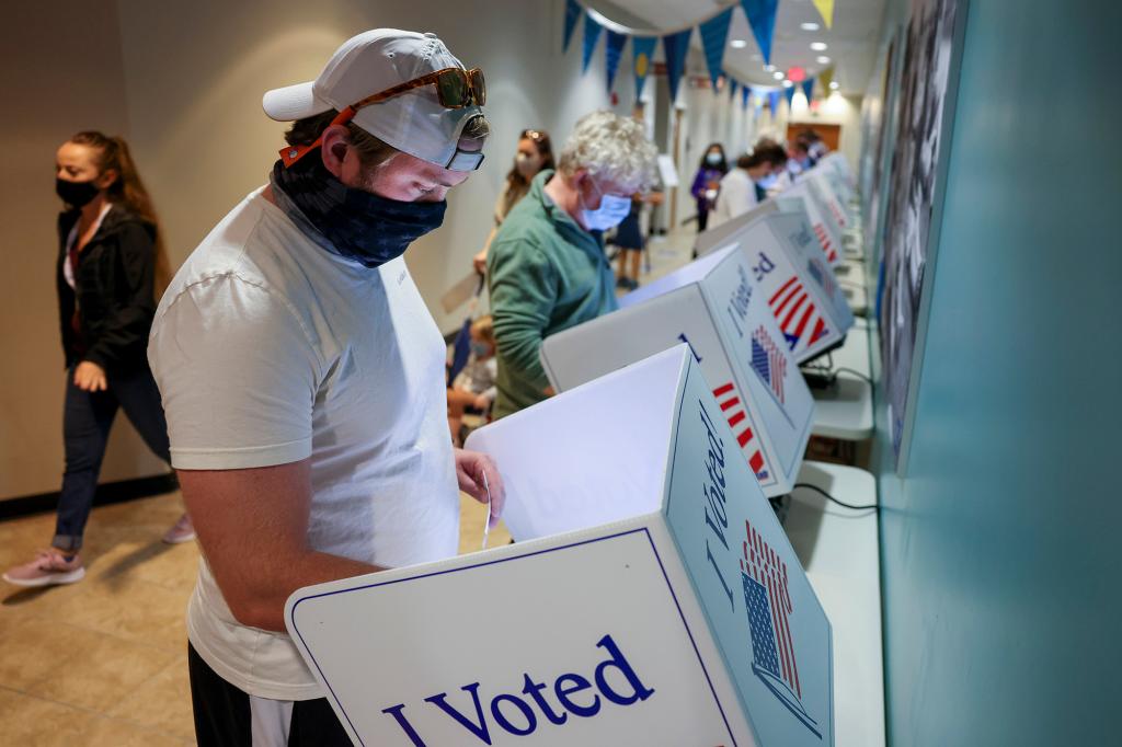 Jake Hannay casts his in-person absentee ballot at Seacoast Church West Ashley on October 30, 2020 in Charleston, South Carolina.