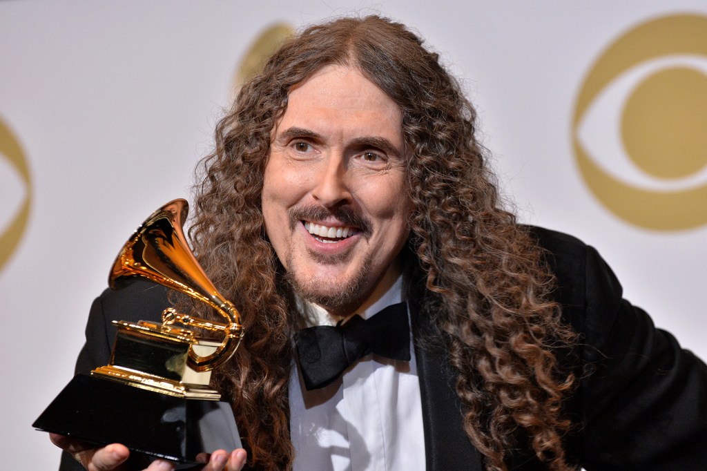 Weird Al Yankovic holds a Grammy 