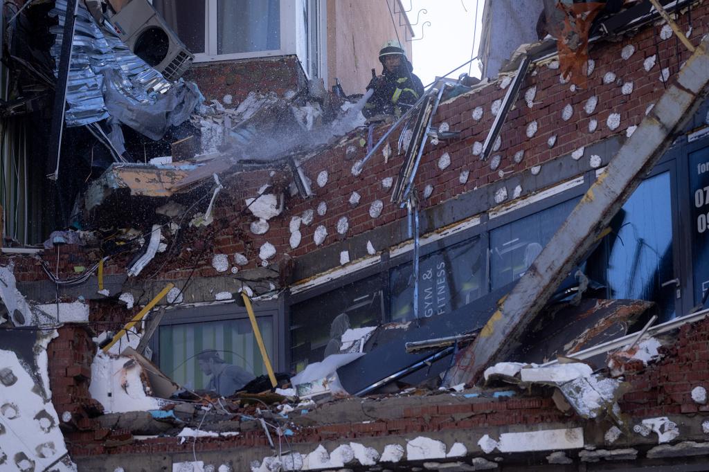 A firefighter at a building that was hit by a Russian missile strike on February 26, 2022 in Kyiv, Ukraine.