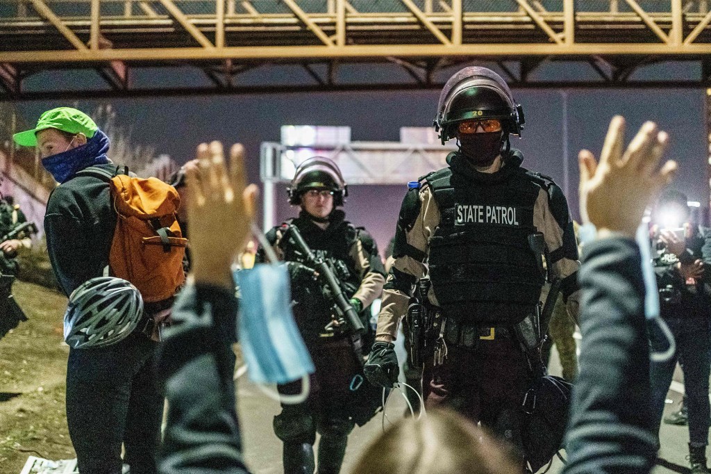 Minneapolis State Patrol arrest journalists and people protesting against racism and issues with the presidential election after they blocked interstate 94 in Minneapolis, Minnesota on November 4, 2020. 