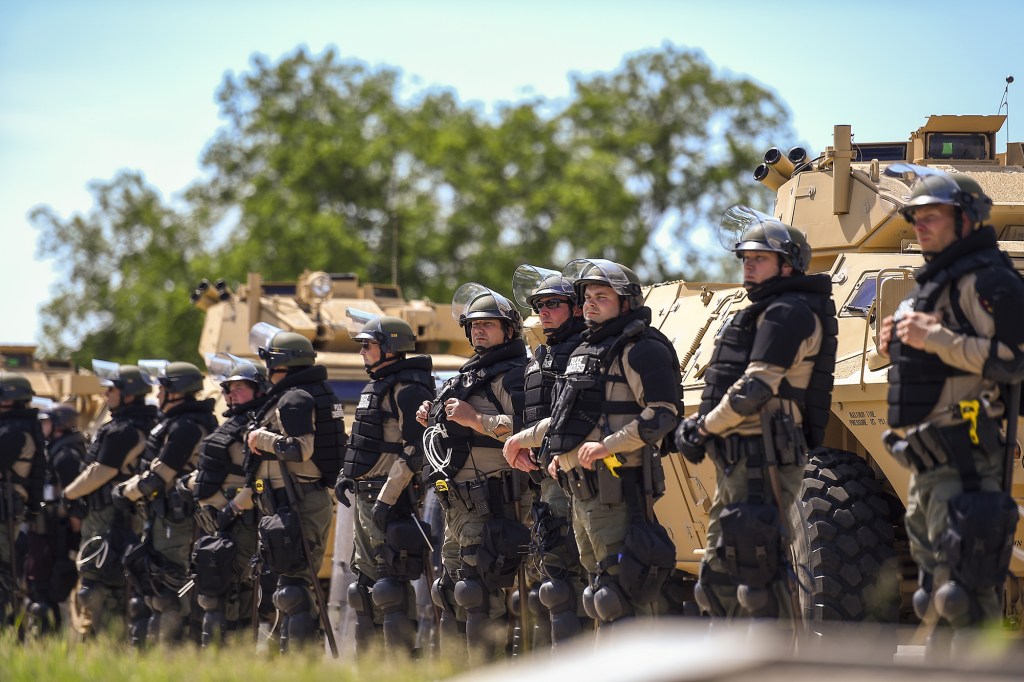 Members of the State Patrol stand guard at the State Capitol during the sixth day of protests over the arrest of George Floyd, who later died in police custody, in St Paul, Minnesota