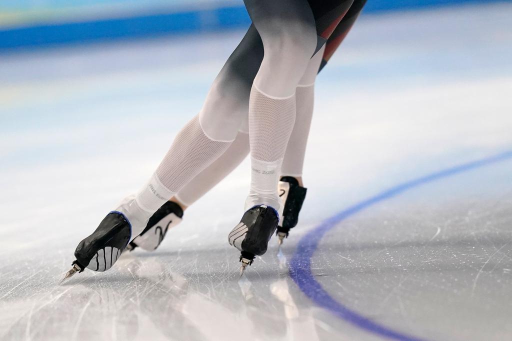 Athletes from Germany skate during a speedskating practice session ahead of the 2022 Winter Olympics, Thursday, Feb. 3, 2022, in Beijing.