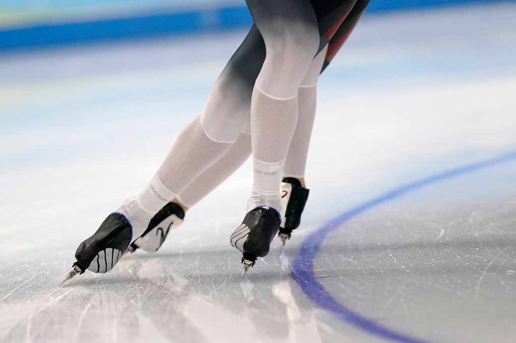 Athletes from Germany skate during a speedskating practice session ahead of the 2022 Winter Olympics, Thursday, Feb. 3, 2022, in Beijing. 