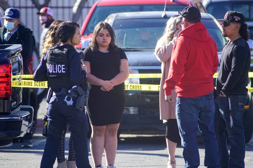 Albuquerque Police talk with bystanders.