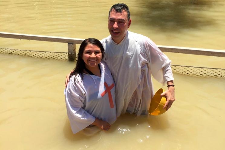 Rev. Andres Arango, right, with Reyes, during a Baptism in the Jordan River, in Israel, in July 2017.