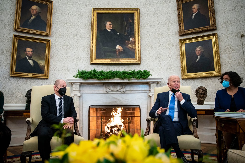 German Chancellor Olaf Scholz and U.S. President Joe Biden speak to reporters before the start of a bilateral meeting.